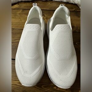 Ladies white slip on sneaker type shoes. Size 6.5. Like new